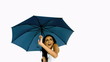 Pretty woman under blue umbrella cowering with fear