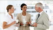 Video: Business team chatting over coffee Business team chatting over coffee