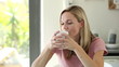 Blonde woman enjoying her drink