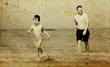 father and son going to swim in the sea. Photo in old image styl