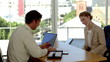 Applicant signing an agreement at the end of a job interview