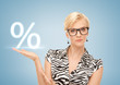 Photo: woman showing sign of percent in her hand woman showing sign of percent in her hand
