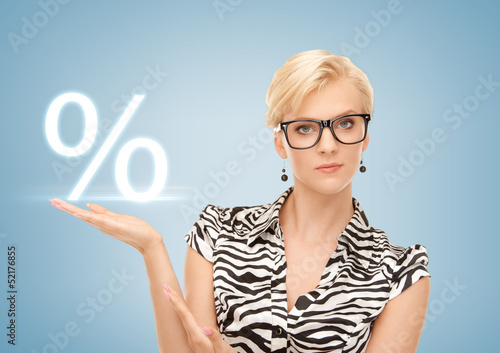 Photo: woman showing sign of percent in her hand woman showing sign of percent in her hand
