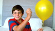 Video: Boy piercing his balloon in the bedroom Boy piercing his balloon in the bedroom