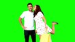 Man being kissed on his cheek by his girlfriend