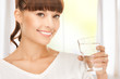 young smiling woman with glass of water
