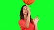 Vidéo : Woman having fun with a basket ball on green screen Woman having fun with a basket ball on green screen