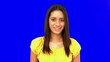 Video: Confused woman being surprised then laughing on blue screen Confused woman being surprised then laughing on blue screen