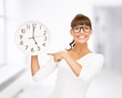 businesswoman with wall clock