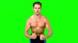 Shirtless serious man flexing muscles