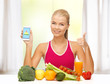 woman with fruits, vegetables and smartphone