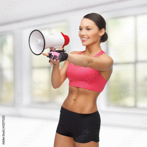 Photo: woman with megaphone pointing at something woman with megaphone pointing at something