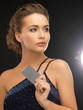 woman in evening dress with plastic card
