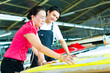 Worker and Dressmaker in a factory