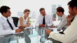 Boss pointing at employees at the meeting room