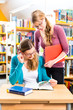 Photo: Students in library are a learning group Students in library are a learning group