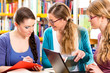 Photo: Students in library are a learning group Students in library are a learning group