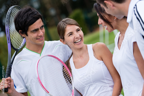 Photo: Friends playing tennis Friends playing tennis