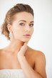 woman wearing shiny diamond earrings