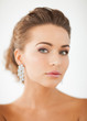 woman wearing shiny diamond earrings