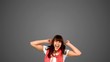 Vidéo : Brunette woman jumping on grey background Brunette woman jumping on grey background