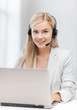 friendly female helpline operator with laptop