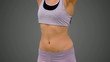 Fit woman raising her arms on white background in slow motion