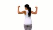 Video: Woman in sportswear tensing her arms on green screen Woman in sportswear tensing her arms on green screen