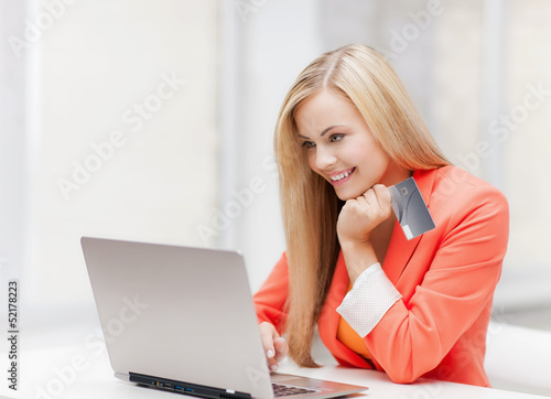 Photo: businesswoman with laptop and credit card businesswoman with laptop and credit card