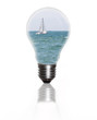 light bulb with sea and sailboat