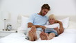 Father and son using tablet together