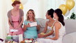 Friends having a party and giving their friend a present