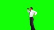 Businessman looking through binoculars while jumping