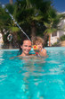 Family in swimming pool