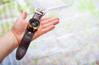 Photo: Closeup image of hand with magnetic compass over a map Closeup image of hand with magnetic compass over a map
