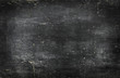 Photo: Empty blank black chalkboard with chalk traces Empty blank black chalkboard with chalk traces