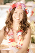 Woman wearing hawaiian flowers garland