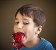 Boy Eating A Lollipop