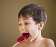 Boy Eating A Lollipop