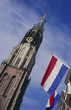 New church and flags at the market place, Delft