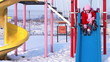Sisters playing in the park in winter.