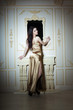 Photo: Girl in golden elegant dress Girl in golden elegant dress