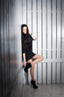 Photo: Sexy posing girl over white wooden background Sexy posing girl over white wooden background