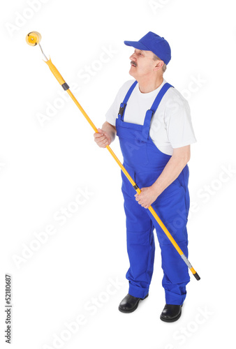 Photo: house painter is painting wall house painter is painting wall