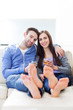 Photo: Couple relaxing on sofa Couple relaxing on sofa