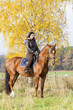 equestrian on horseback in autumnal nature