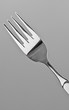 Single fork before grey background