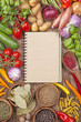 Assortment of vegetables and blank recipe book