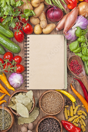 Photo: Assortment of vegetables and blank recipe book Assortment of vegetables and blank recipe book