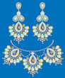 necklace with pearls and earrings on a blue background